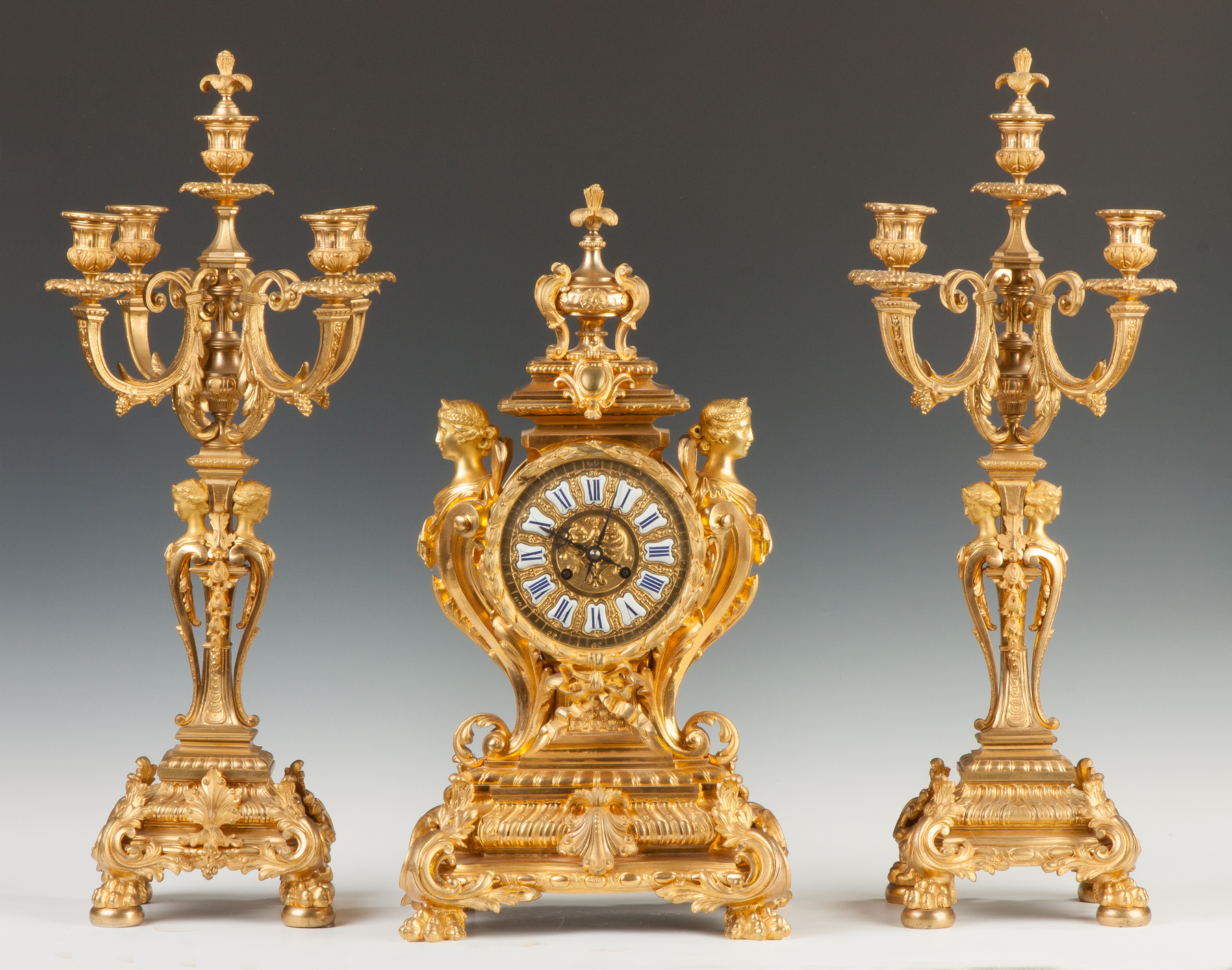 Appraisal: French Gilt Bronze Three Piece Clock Set th century Winged