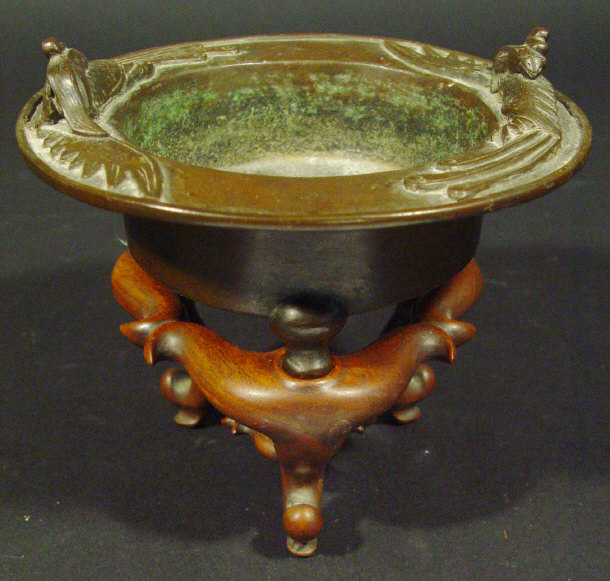 Appraisal: Oriental three footed bronze bowl cast in relief with birds