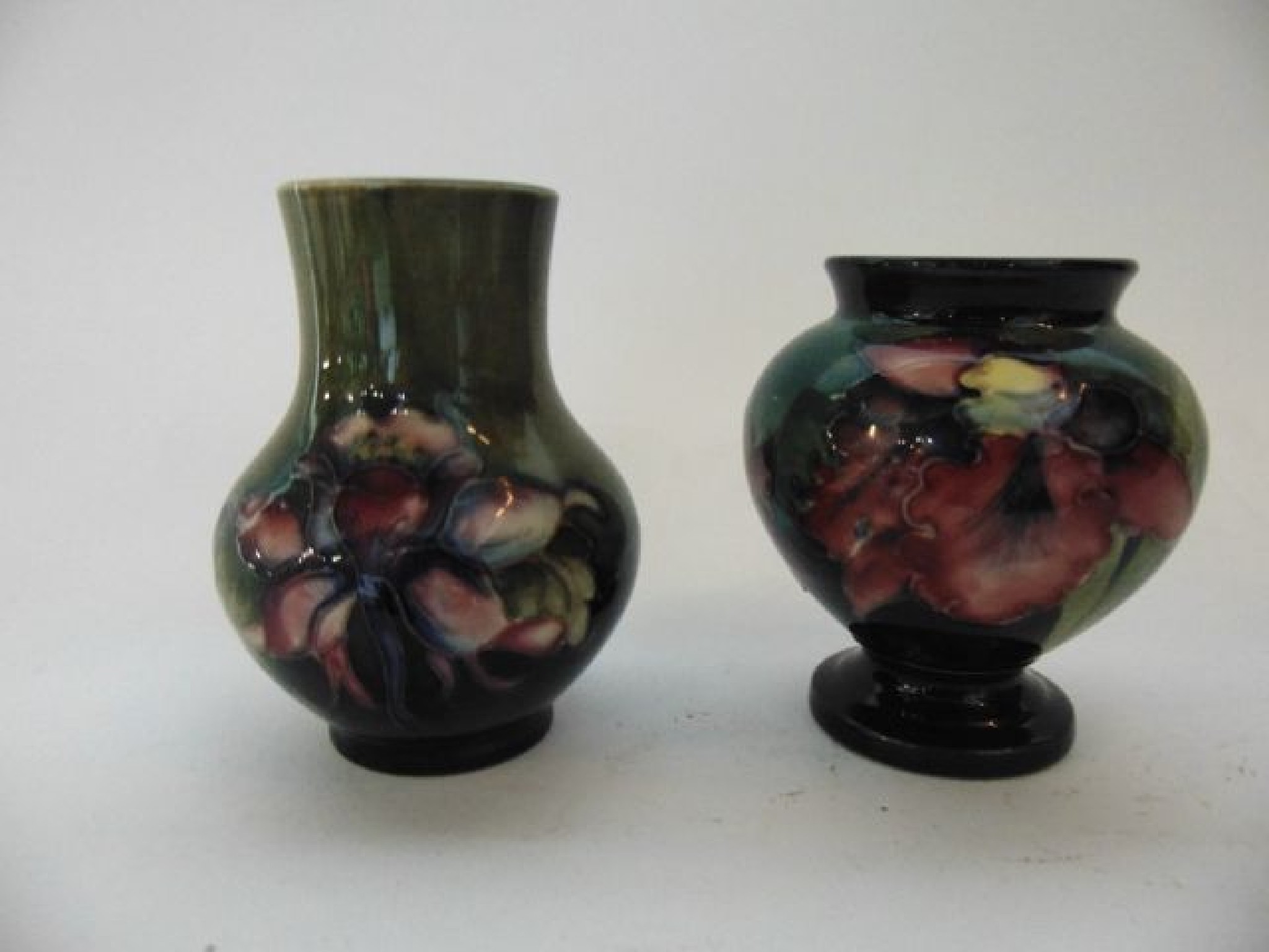 Appraisal: Two Moorcroft vases with graduated blue and green grounds one