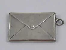 Appraisal: A silver two compartment envelope stamp case with suspensory loop