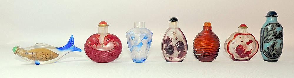 Appraisal: Seven Peking Glass Snuff Bottles Seven Peking glass snuff bottles