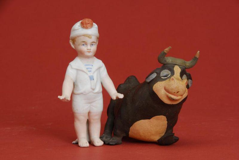 Appraisal: All Bisque Boy with Ferdinand the Bull Lot includes a