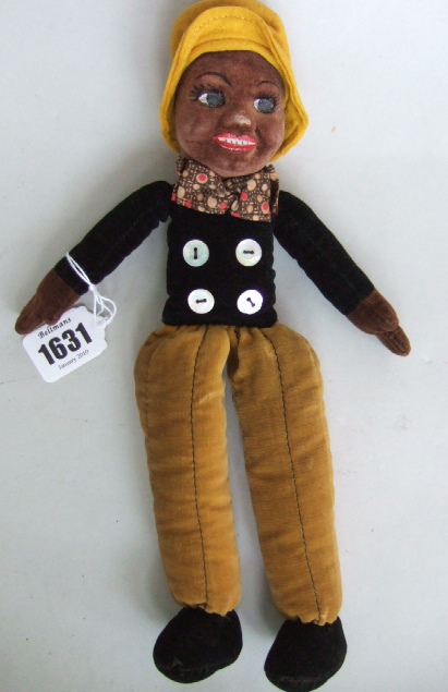 Appraisal: A Norah Wellings rag doll with coloured face and hands