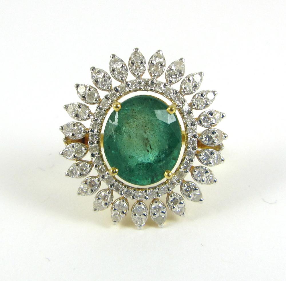 Appraisal: EMERALD DIAMOND AND EIGHTEEN KARAT GOLD RING The yellow and