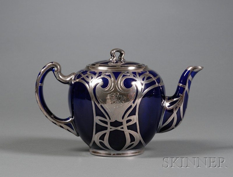 Appraisal: American Sterling Overlay Earthenware Teapot early th century the ovoid