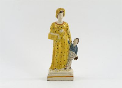 Appraisal: A Prattware group of a mother and child she wearing