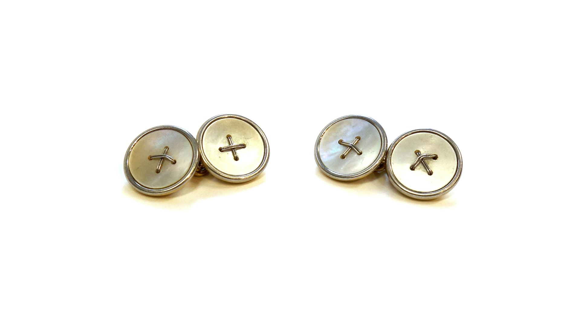 Appraisal: A pair of gold and mother of pearl dress cufflinks