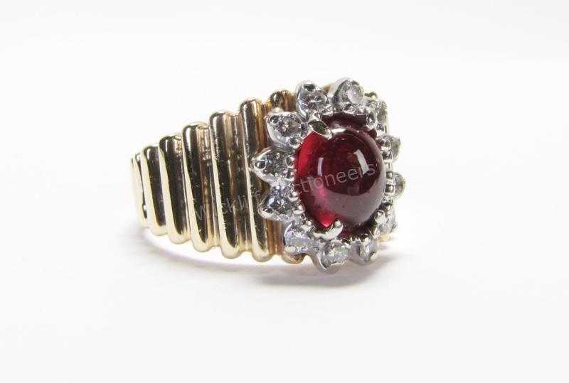 Appraisal: A K yellow gold ring with natural cabochon ruby center