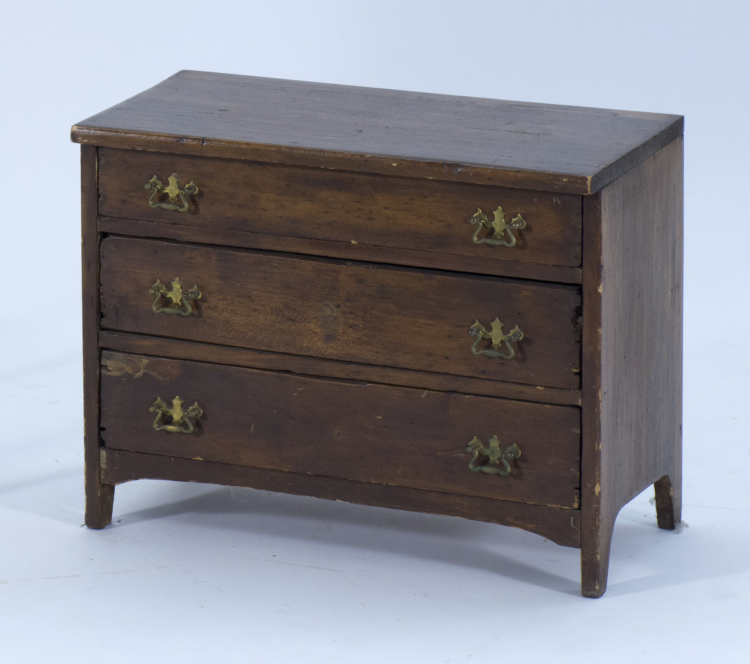 Appraisal: CHILD'S CHEST In pine with three drawers and brass bail