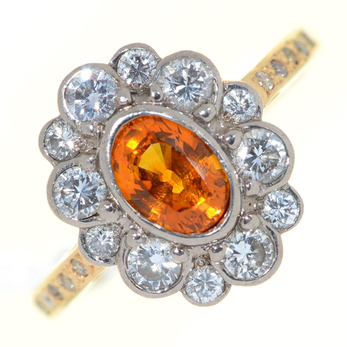 Appraisal: An orange sapphire and diamond cluster ring in ct gold