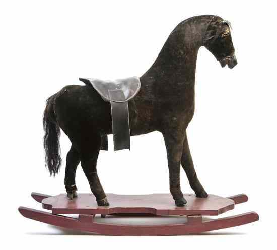 Appraisal: A Child's Rocking Horse together with a leather wrapped pull