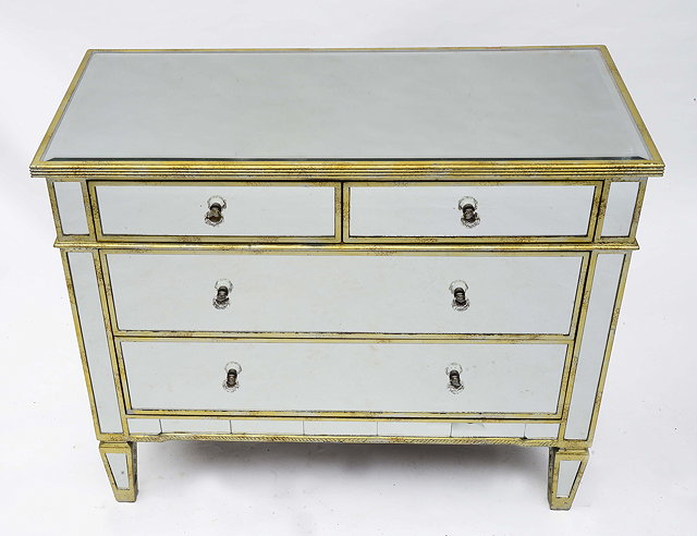 Appraisal: A MIRRORED AND PARCEL GILT CHEST of two short and