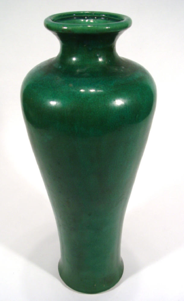 Appraisal: Tall oriental stoneware vase decorated in a green glaze cm