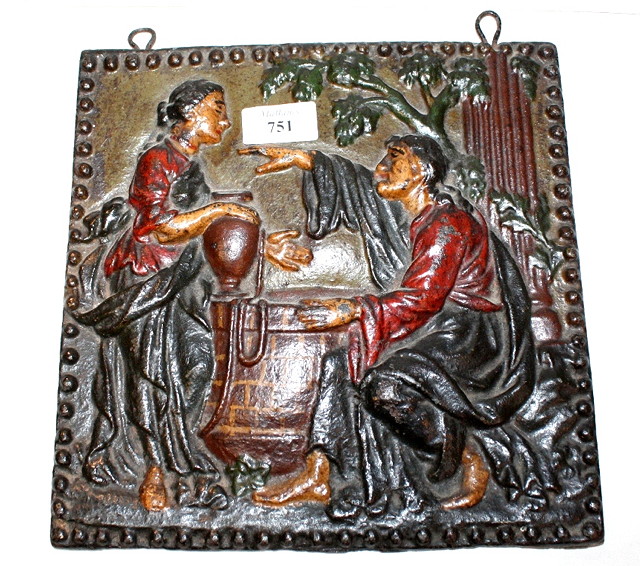 Appraisal: A CAST IRON SQUARE WALL PLAQUE with painted decoration of