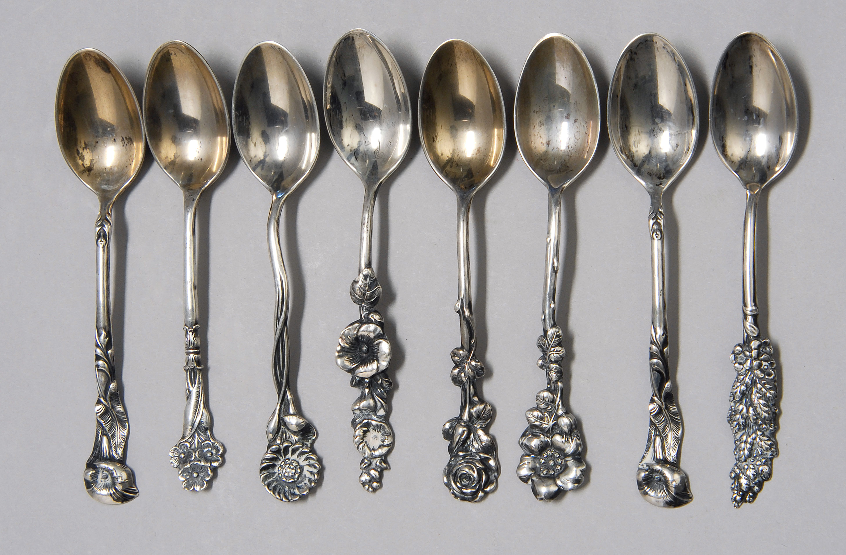 Appraisal: EIGHT STERLING SILVER DEMITASSE SPOONS by Reed Barton With ornate