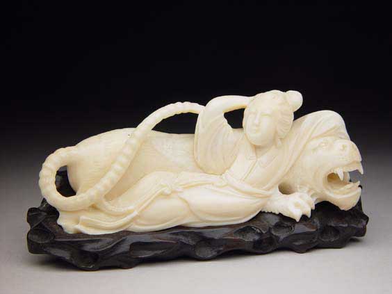 Appraisal: CARVED IVORY GROUP Well carved Chinese ivory model of a