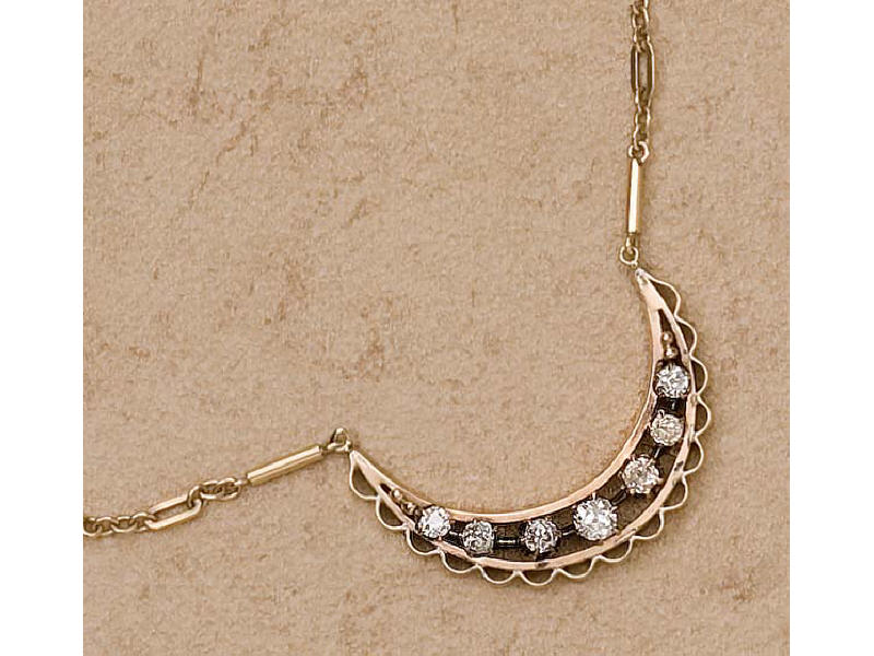 Appraisal: DIAMOND NECKLACE k yellow gold crescent design with seven mine