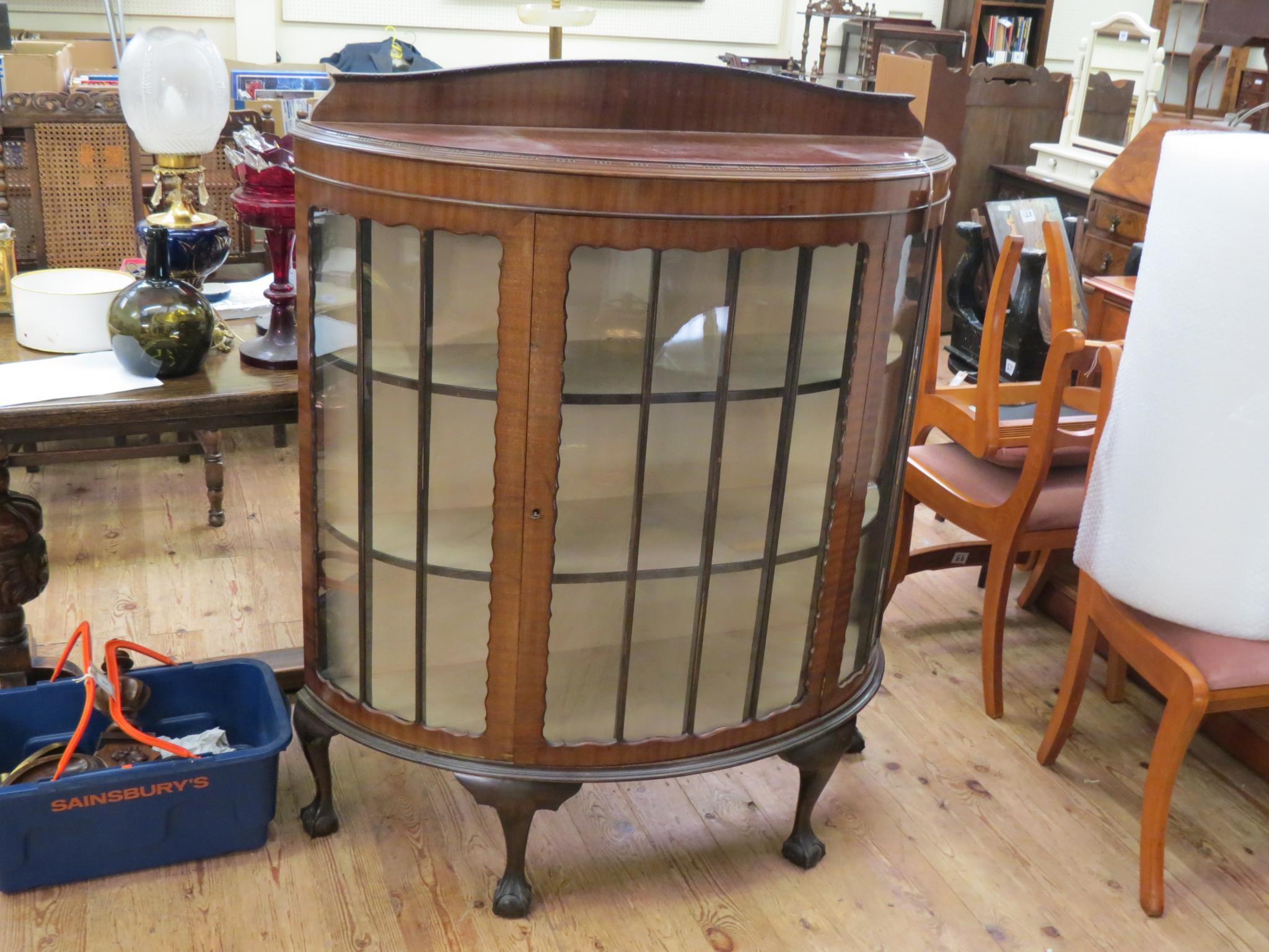 Appraisal: A George V mahogany display cabinet convex-shape enclosed by single