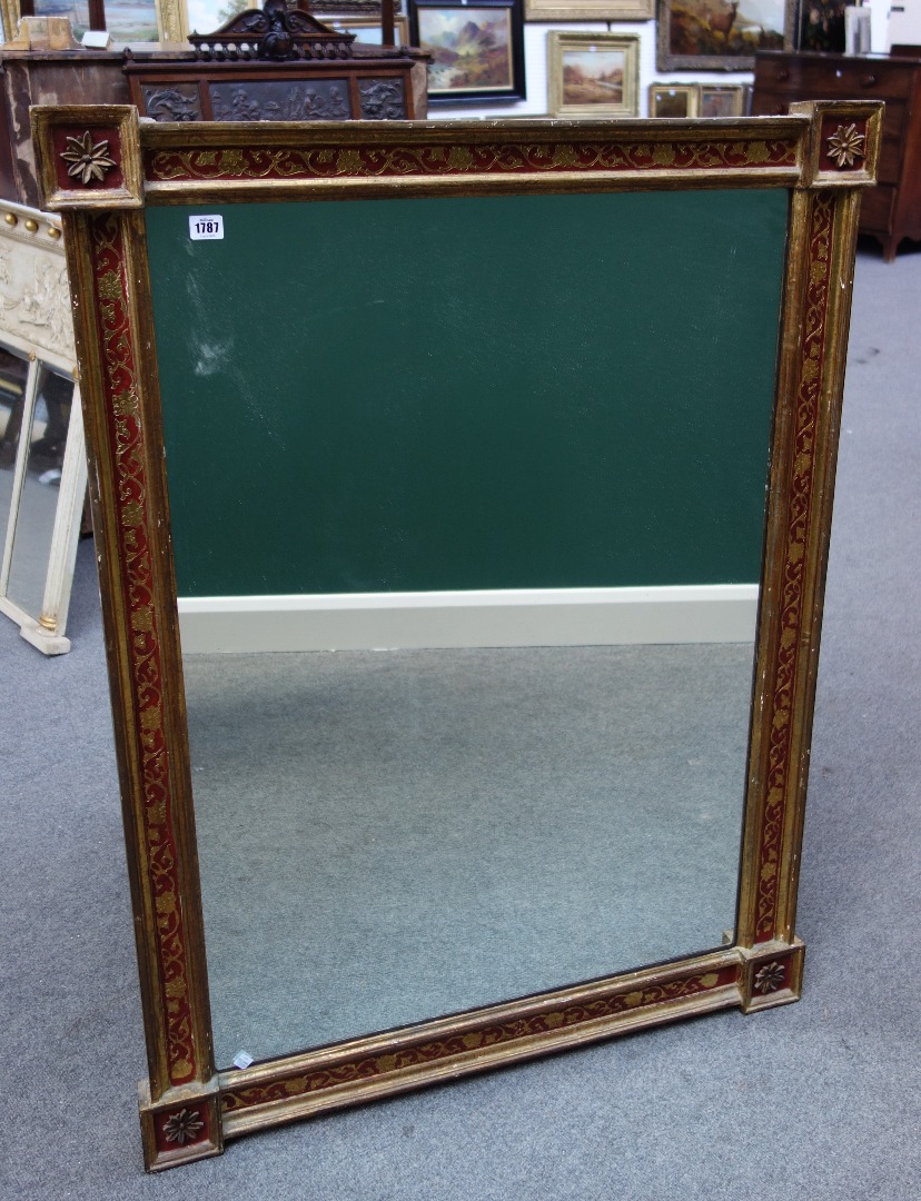 Appraisal: A th century parcel gilt red painted rectangular wall mirror