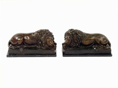 Appraisal: A pair of bronze models of recumbent lions on slate