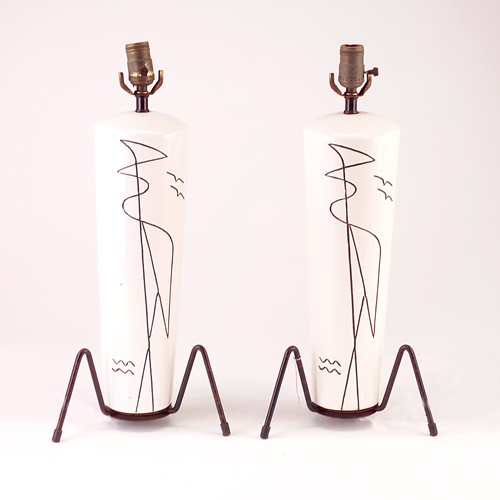 Appraisal: Pair of white ceramic lamps with modernist etchings raised on