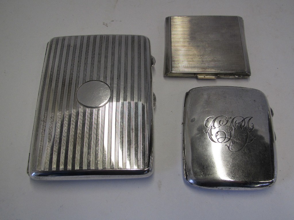 Appraisal: Lot comprising two silver cigarette cases and a compact