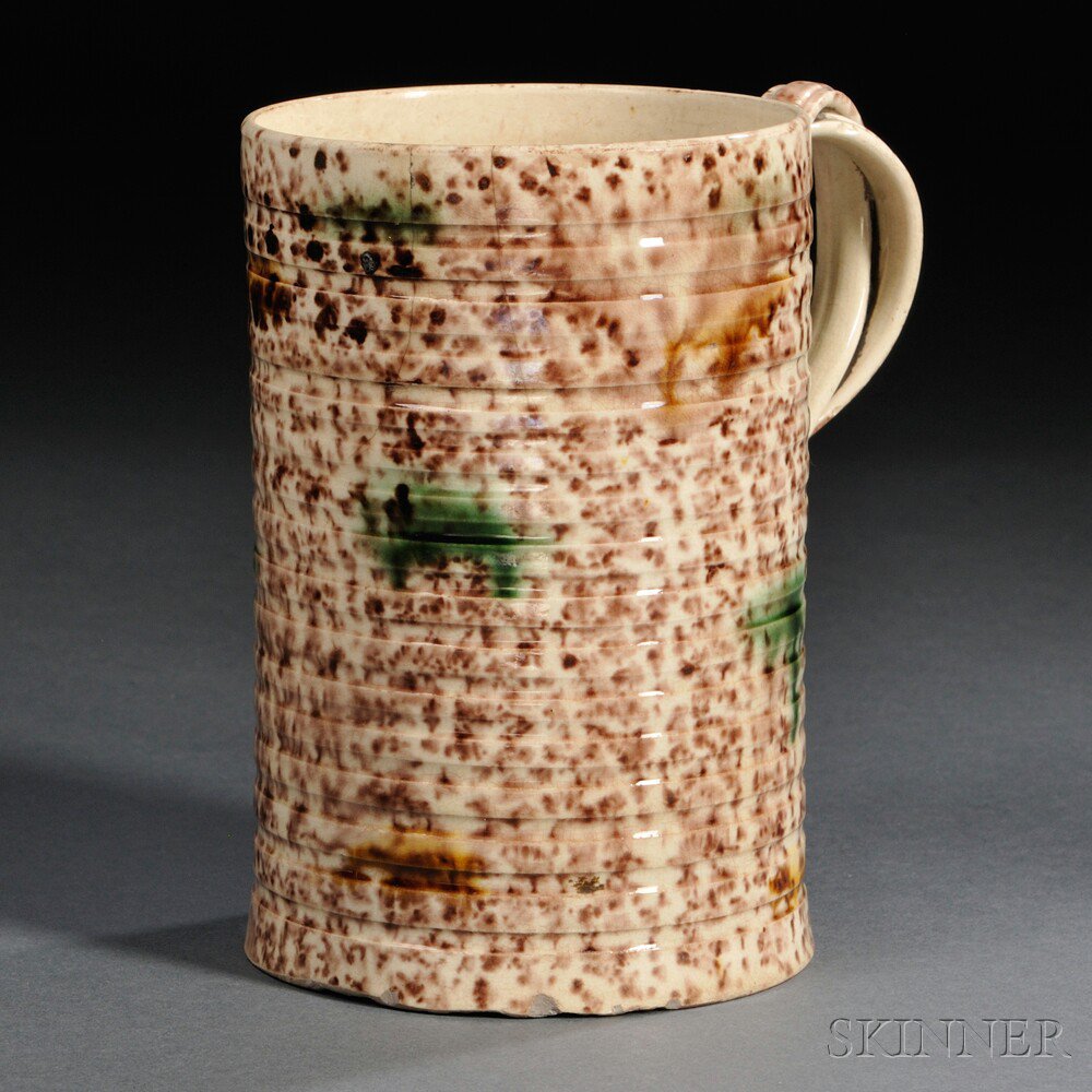 Appraisal: Staffordshire Cream-colored Earthenware Tankard England c cylindrical with entwined strap