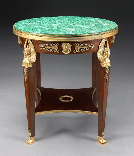 Appraisal: An Empire style gilt bronze mounted mahogany center table first