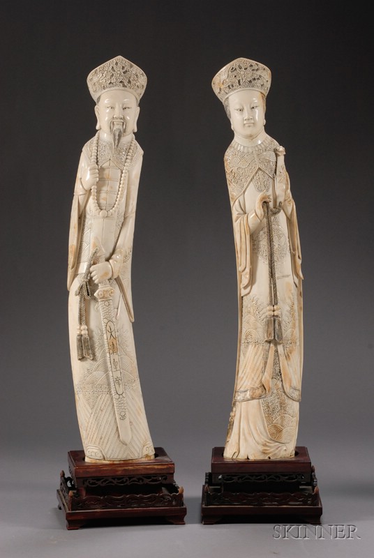 Appraisal: Pair of Large Ivory Carvings China figures of a court