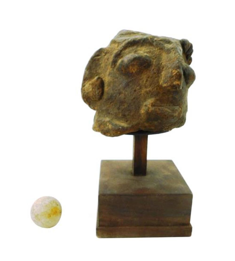 Appraisal: TRIBAL Stone head fragment on stand and an abnormally near