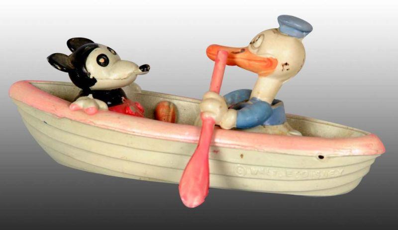 Appraisal: Walt Disney Mickey Minnie Mouse in Rowboat Toy Description Japanese