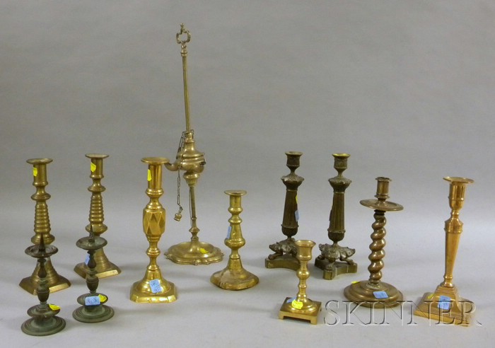 Appraisal: Brass Lamp and Eleven Brass Candlesticks including a lucerna a