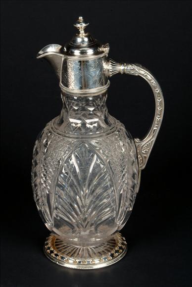 Appraisal: A Victorian electro-plate mounted cut glass claret jug the engraved