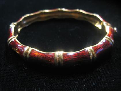 Appraisal: karat yellow gold and enamel bamboo style bangle bracelet Martine