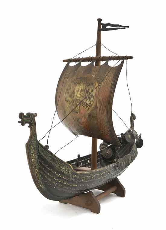 Appraisal: A Silvered Model of a Viking Long Boat realistically cast