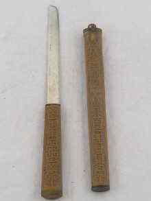 Appraisal: A Chinese bone bladed paper knife the handle and scabbard