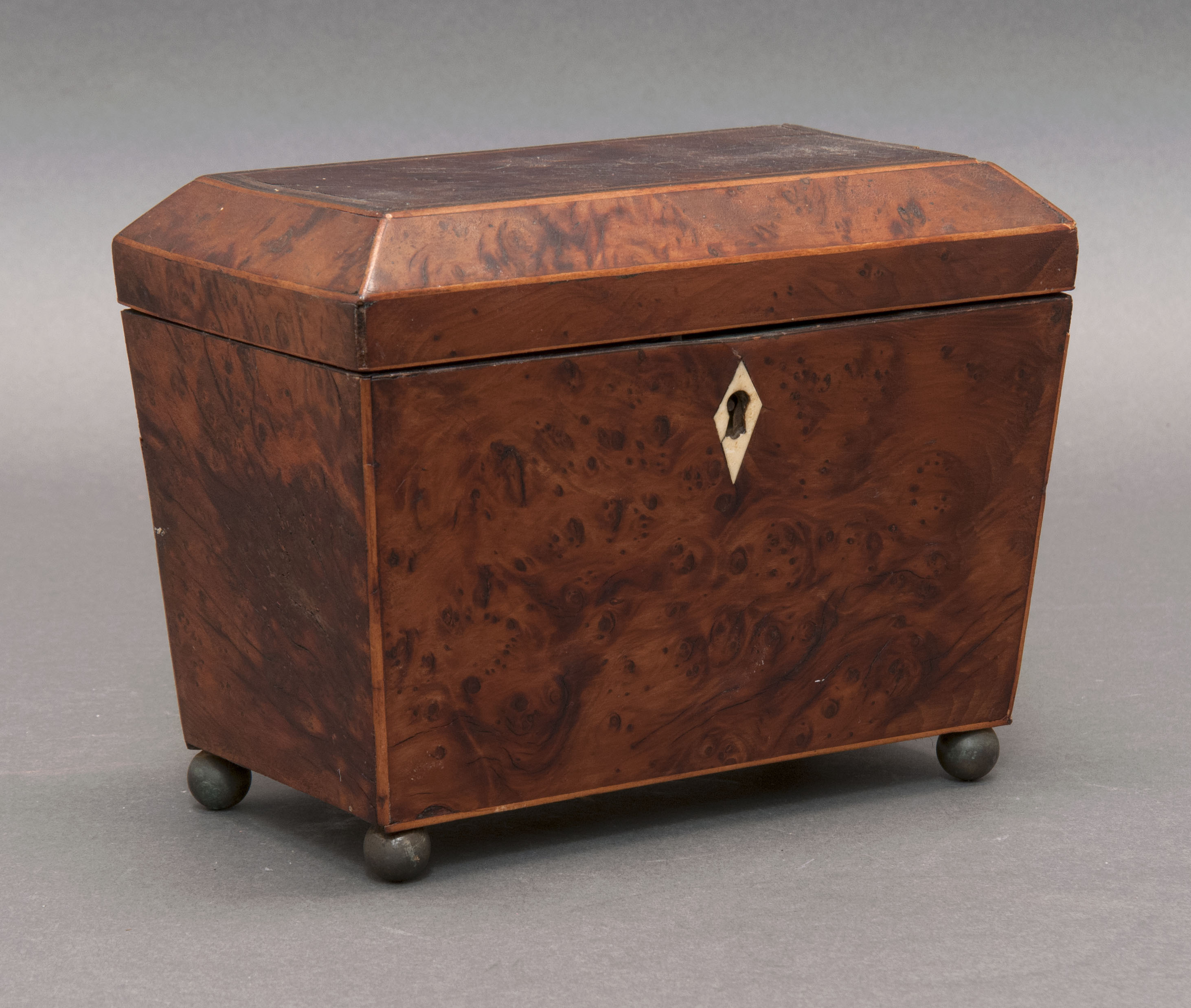 Appraisal: SARCOPHAGUS-FORM TEA CADDY English th CenturyIn burled veneer with line