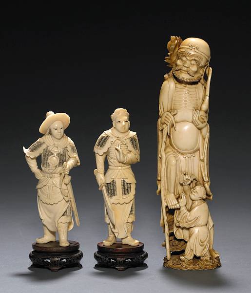 Appraisal: A group of three carved ivory figures th Century Including