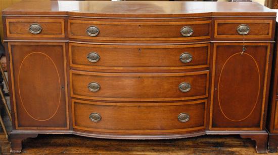 Appraisal: KITTINGER SIDEBOARD Mahogany bowfront four central graduated drawers flanked by