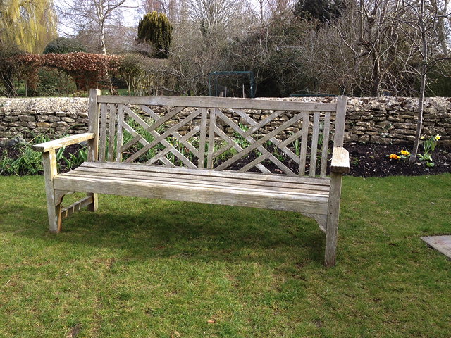 Appraisal: A TEAK GARDEN BENCH with slatted back and seat cm