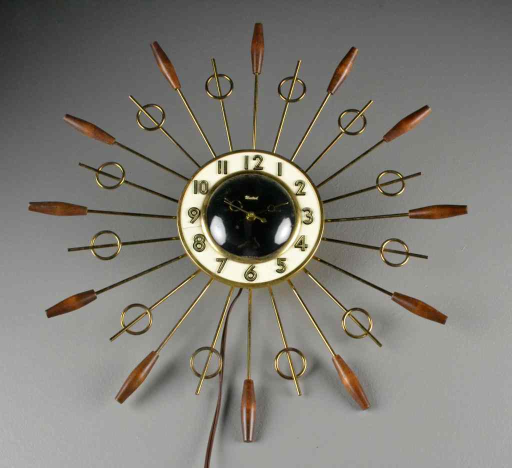 Appraisal: Eames-Style Mid Century Modern Wall ClockUnited brand electric wall clock