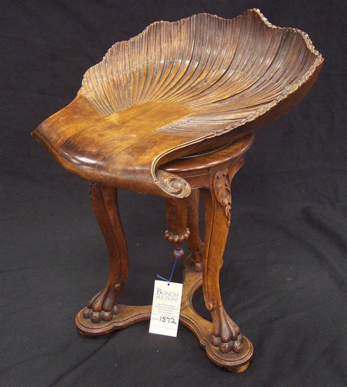 Appraisal: Mahogany carved Continental piano stool with shelf form seat some