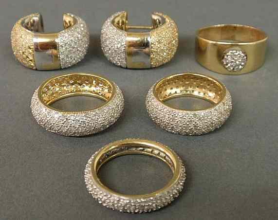 Appraisal: Two matching K yg diamond encrusted bands a k yg