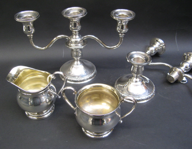 Appraisal: FOUR STERLING SILVER TABLE ACCESSORIES International Sterling Co in the