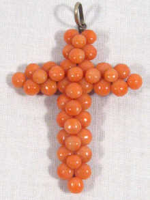 Appraisal: An antique coral and silver cross the coral beads measuring