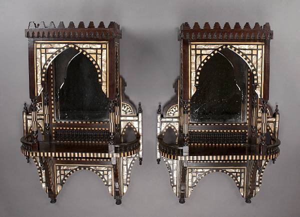 Appraisal: A pair of Levantine mirror mounted shell inlaid hardwood hanging