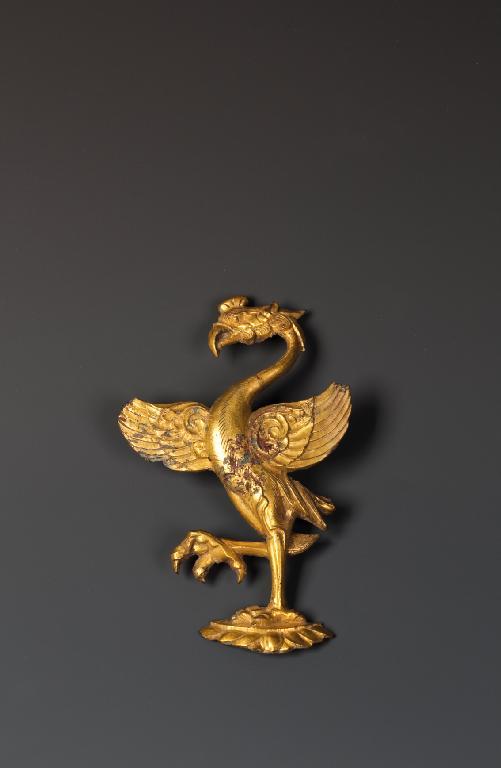 Appraisal: A CHINESE GILT BRONZE PHOENIX MOUNT standing on one leg