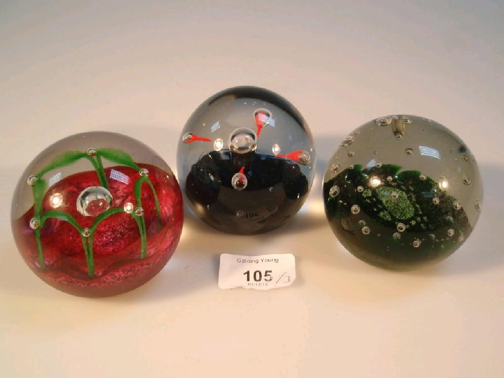 Appraisal: Three Caithness glass paperweights marked C G to underside