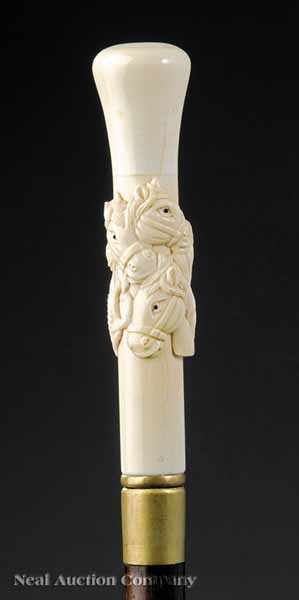 Appraisal: A Mahogany and Hand-Carved Bone Cane the handle carved with