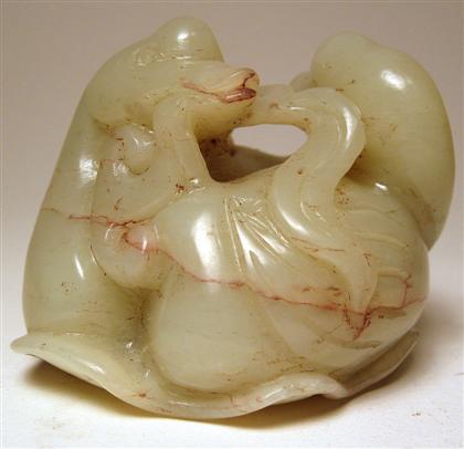 Appraisal: Chinese white jade carvingGrouping depicts two geese on a lotus